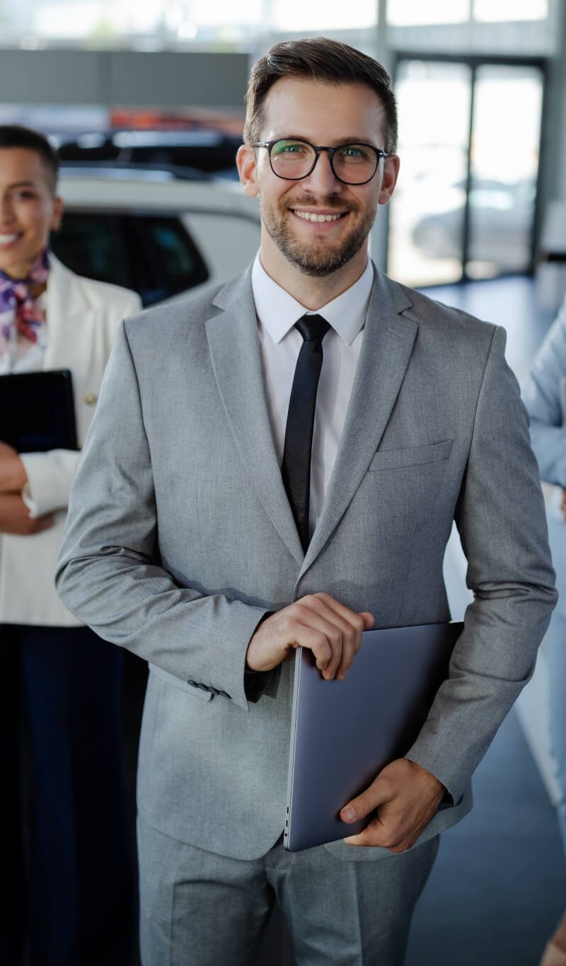 salesteam-in-dealership-three-beautiful-consultants-or-managers-in-elegant-suit-looking-on-camera-.jpg